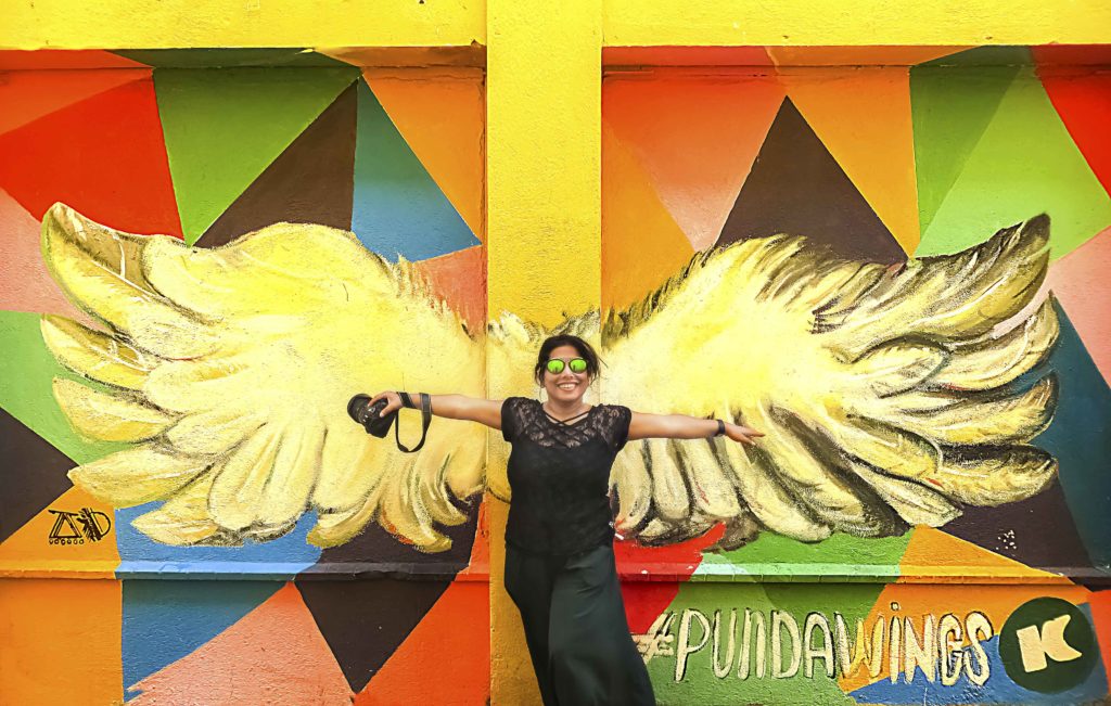 Self portrait of a photographer with background of flying wings