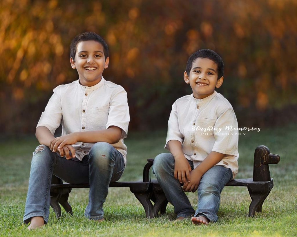 brothers outdoor portrait in a park for their summer photoshoot