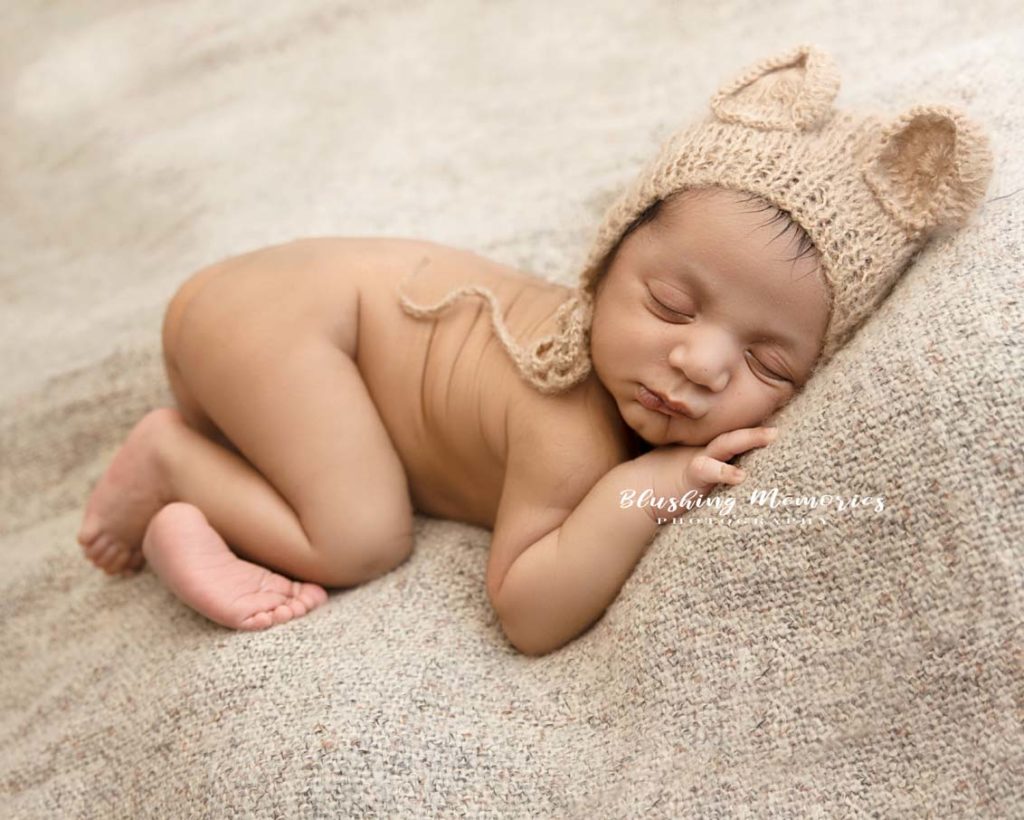 newborn baby photoshoot in a lying position