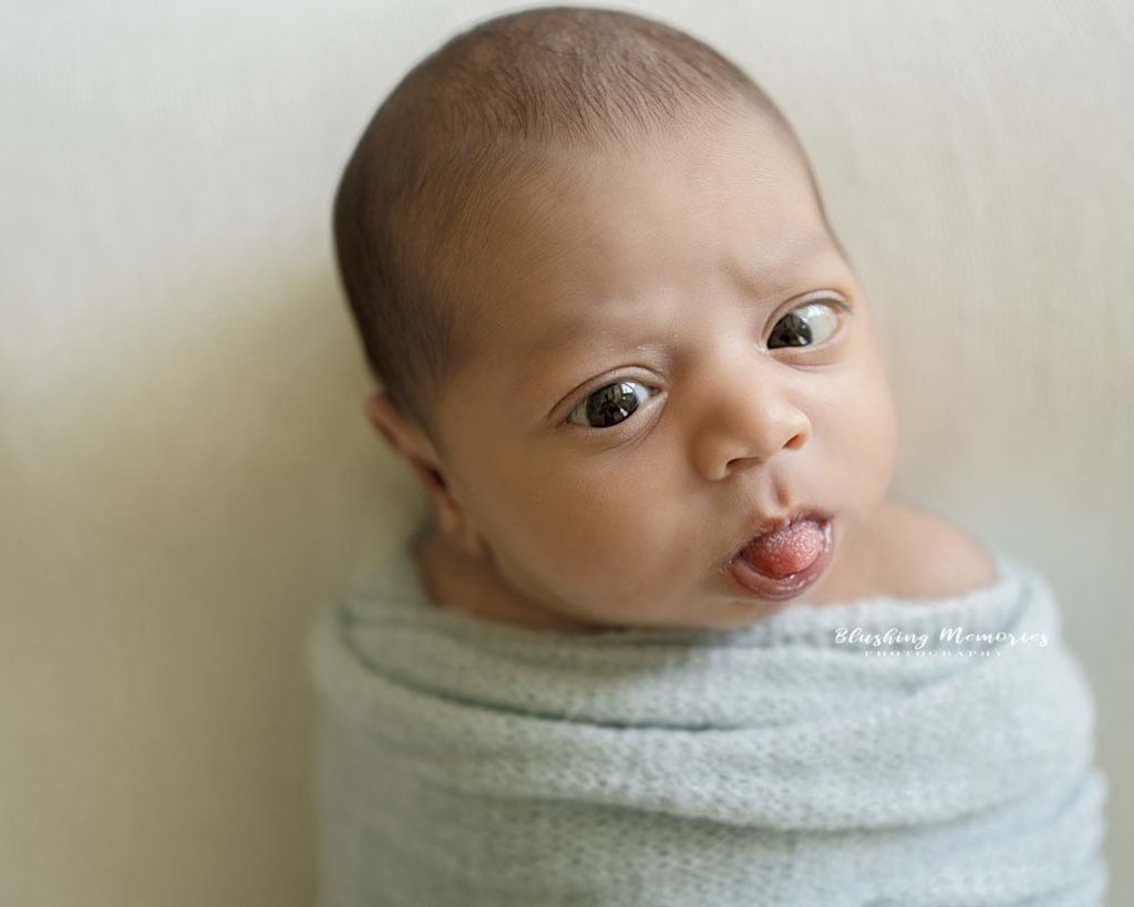 newborn baby boy photoshoot in a posed studio session