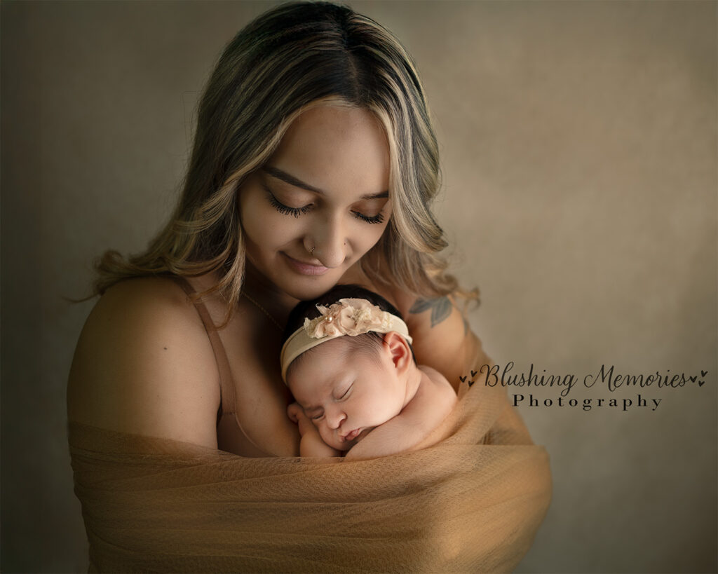 Mother with her one year old baby girl for newborn photo session