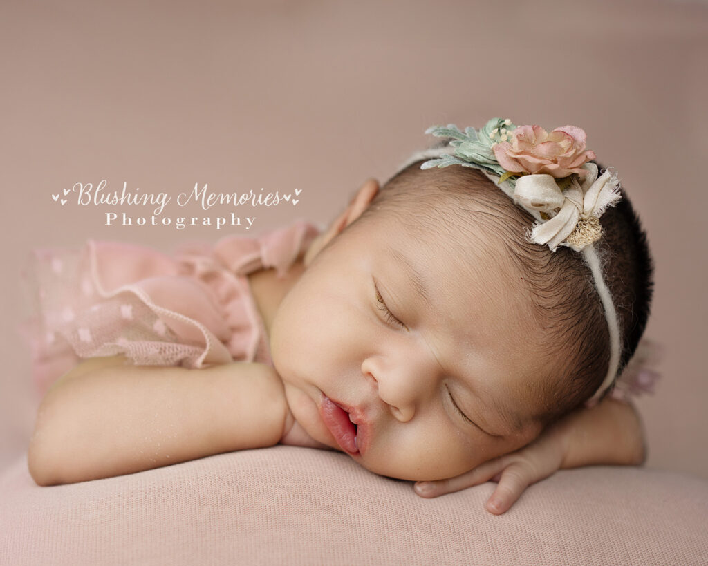 Newborn baby girl sleeping in pink dress with floral headband – Blushing Memories Photography, El Dorado Hills, Folsom, Sacramento, Bay Area