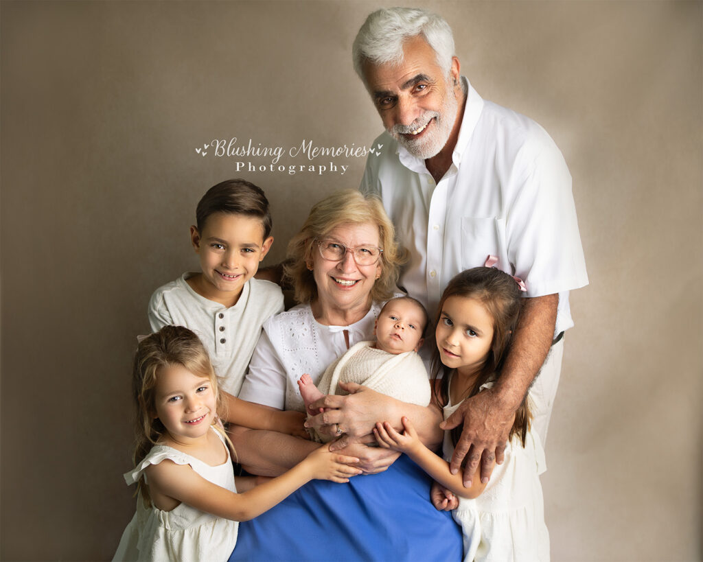 newborn baby photo at Blushing Memories Studio, El Dorado hills with their sibling and grandparent