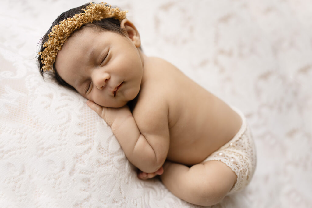 Newborn baby girl photoshoot in Folsom CA by Blushing Memories studio, soft neutral tones with delicate headband