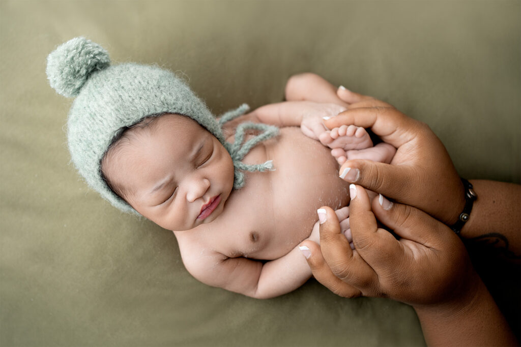 Mother holding newborn baby boy at El Dorado Hills photography studio