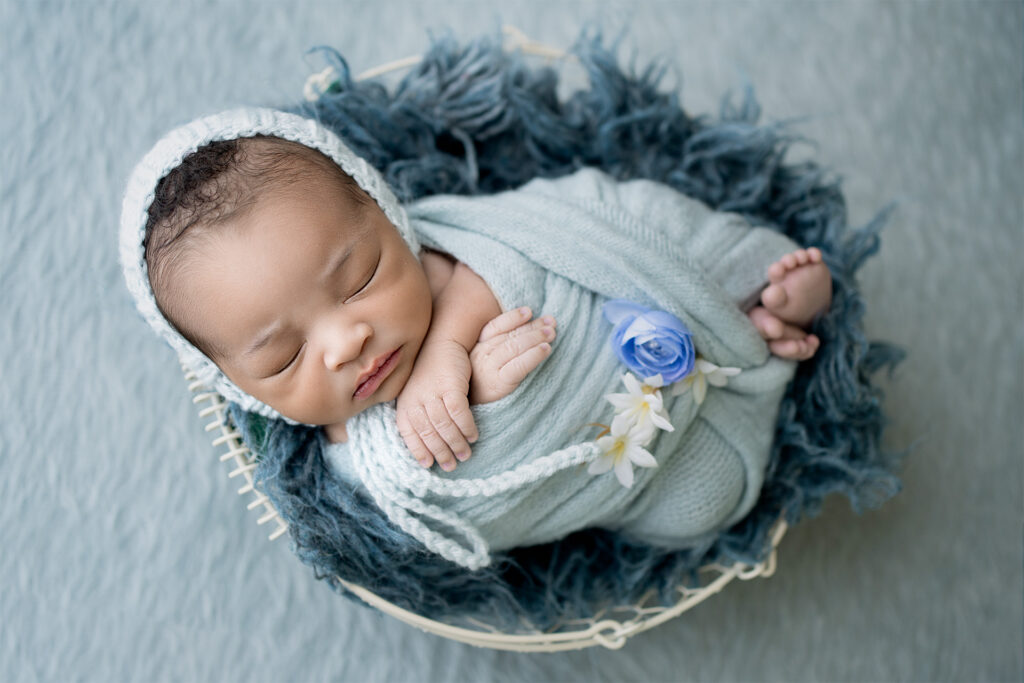 Newborn baby boy portrait in basket at El Dorado Hills studio
